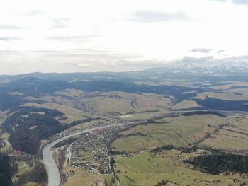 High angle view of agricultural landscape against sky