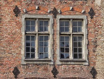 Low angle view of window on old building