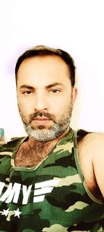 Portrait of young man against white background