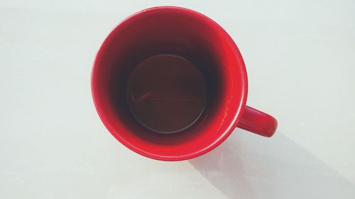 Directly above shot of red cup on table