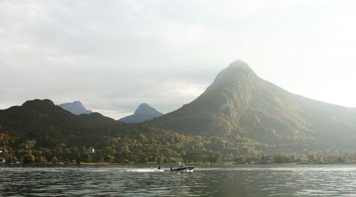 Scenic view of bay against mountains