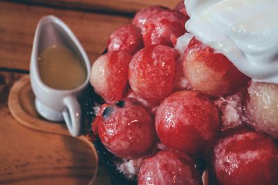 Close-up of fresh strawberries in plate on table