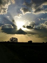 Scenic view of field against sky during sunset