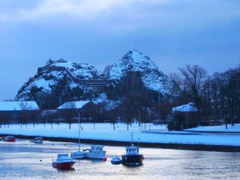 Scenic view of lake against sky during winter