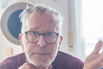 Close-up portrait of man wearing eyeglasses