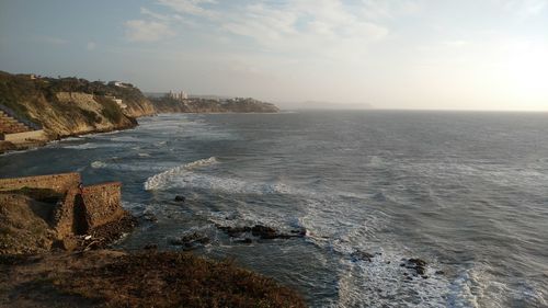 Scenic view of sea against cloudy sky