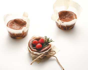 High angle view of dessert on white table