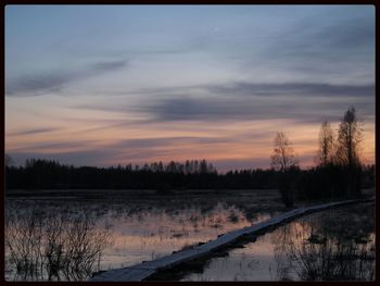 Scenic view of landscape at sunset