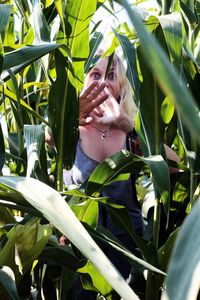 Close-up of woman in plant