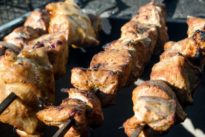 High angle view of meat on barbecue grill