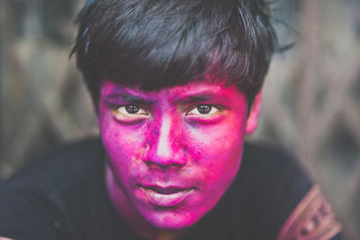 Portrait of man with face paint during holi