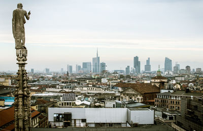 Buildings in city against sky