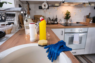 Cropped hand of person preparing food in kitchen