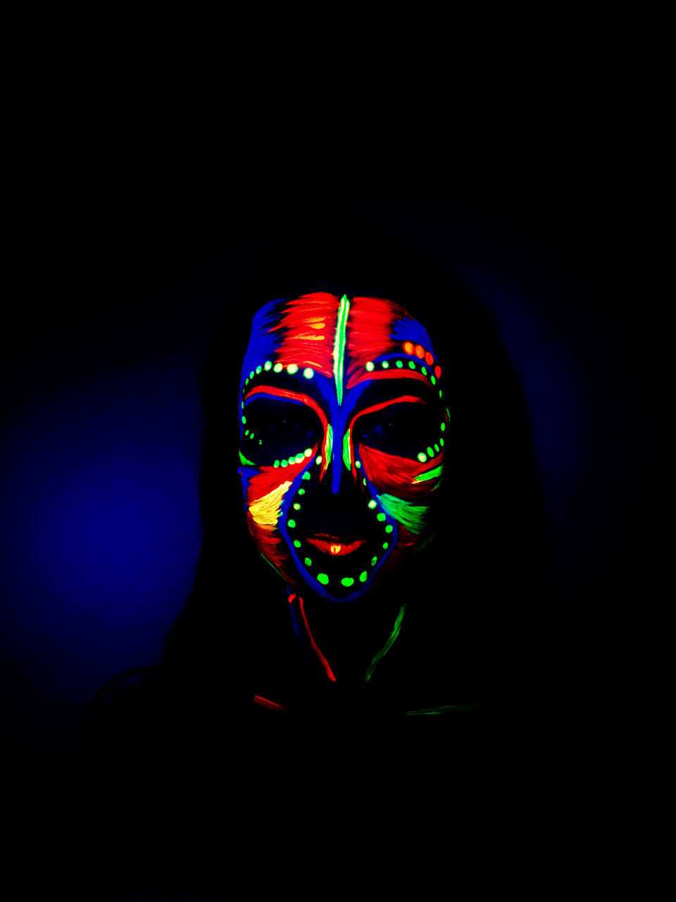 indoors, multi colored, studio shot, one person, black background, illuminated, dark, front view, darkroom, human body part, copy space, headshot, paint, creativity, face paint, light - natural phenomenon, portrait, body part, close-up, neon, human face, beautiful woman