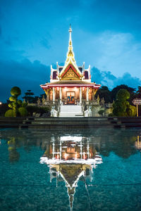 Temple building against cloudy sky