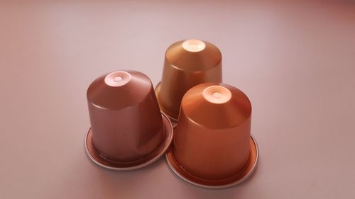 Close-up of candles on table against white background