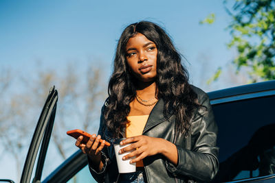 Portrait of young woman looking at camera