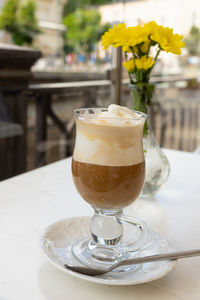 Close-up of coffee served on table