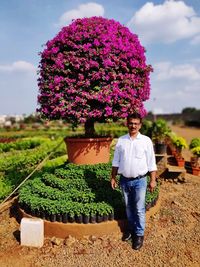 Full length of man standing against plants at park