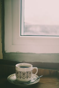 Coffee cup on table at home