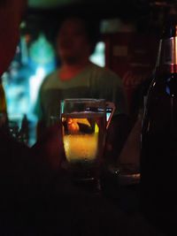 Close-up of beer drinking glass on table