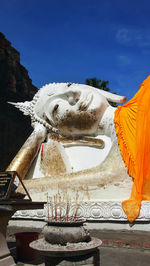 Statue of buddha against sky
