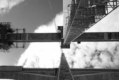 Low angle view of smoke emitting from building against sky