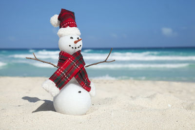 Close-up of christmas decoration on beach