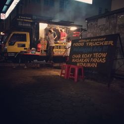 Information sign in city at night