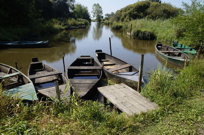 Boats moored in lake