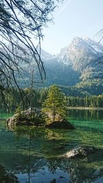 Scenic view of lake and mountains against sky