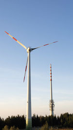 Low angle view of windmill against sky