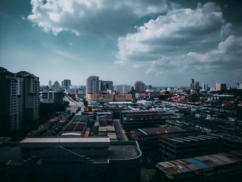 High angle view of buildings in city against sky