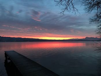 Scenic view of lake against sky during sunset