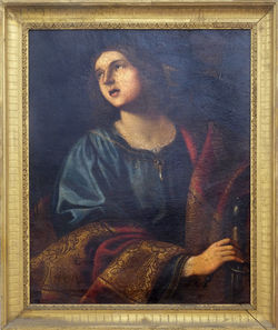 Portrait of young man sitting on book