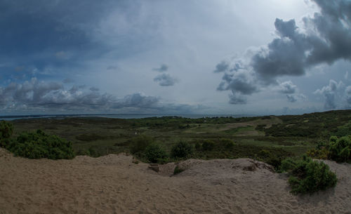 Scenic view of beach against sky