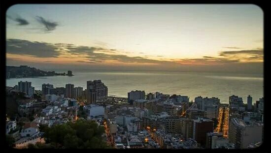 cityscape, city, building exterior, architecture, built structure, crowded, sky, sunset, high angle view, skyscraper, residential district, cloud - sky, residential building, residential structure, tower, city life, auto post production filter, transfer print, sea, tall - high