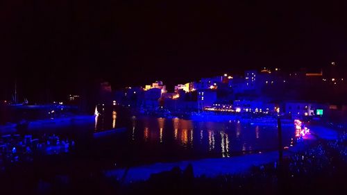 Illuminated buildings in city at night