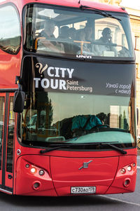 Close-up of red car in city