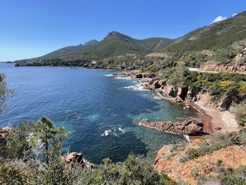 Scenic view of sea against clear blue sky