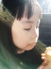 Close-up portrait of cute girl with ice cream