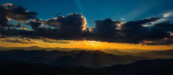 Scenic view of dramatic sky during sunset