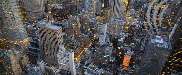 Aerial view of buildings in city at night