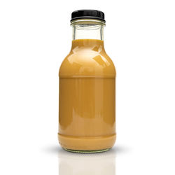 Close-up of glass bottle against white background