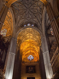 Low angle view of illuminated ceiling of building