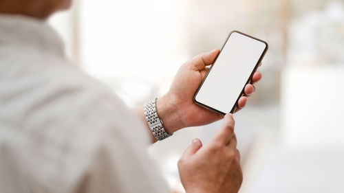 Midsection of woman using mobile phone