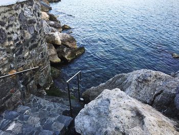 High angle view of rocks in sea