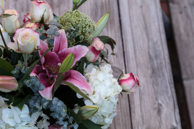 High angle view of bouquet on wooden table