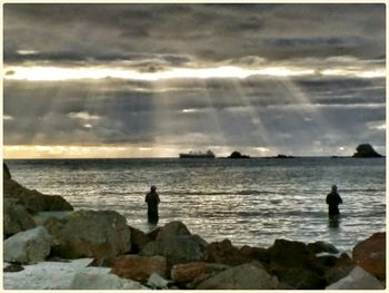 Scenic view of sea against cloudy sky