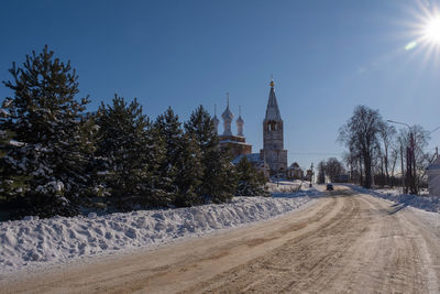 Panoramic view of trees and buildings against sky